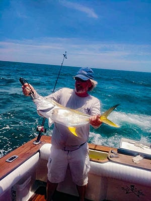 John Broderick With a Big Catch on his fishing charter